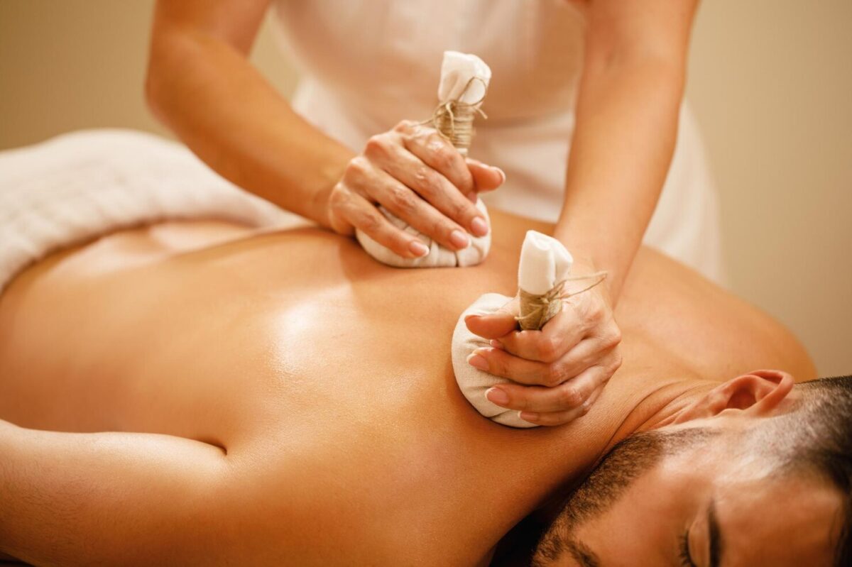closeup-man-getting-back-massage-with-detox-herbal-balls-health-spa_637285-2249-1200x799.jpg