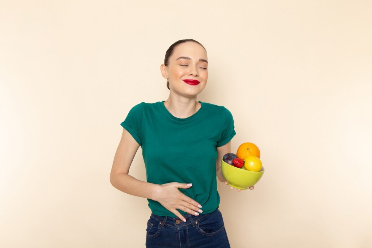 front-view-young-attractive-female-dark-green-shirt-holding-plate-with-fruits-with-smile_140725-21058-1200x799.jpg